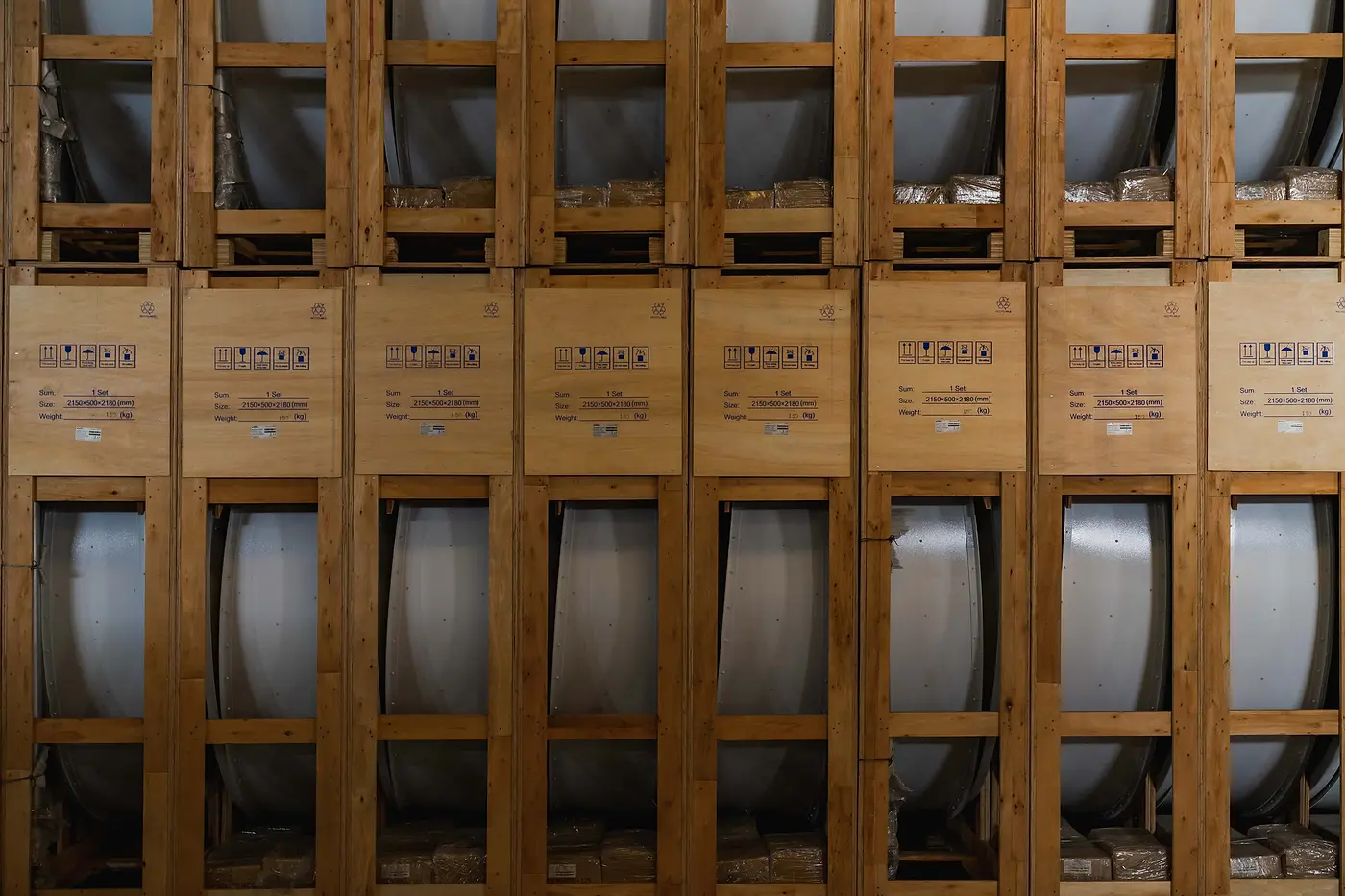 A wall of crated cable drums in the DMM warehouse