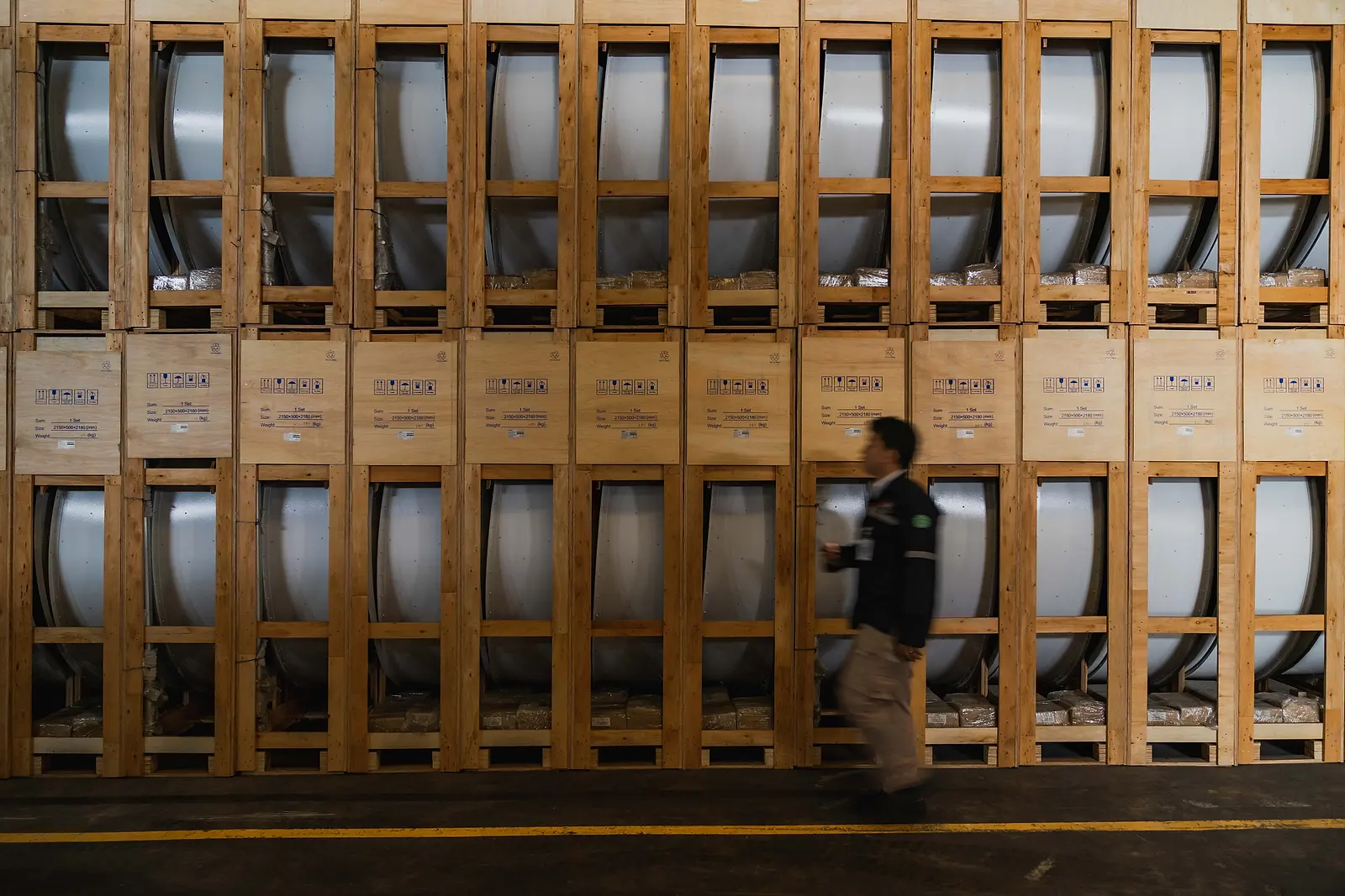 Cable drums and timber crates stored in the DMM warehouse