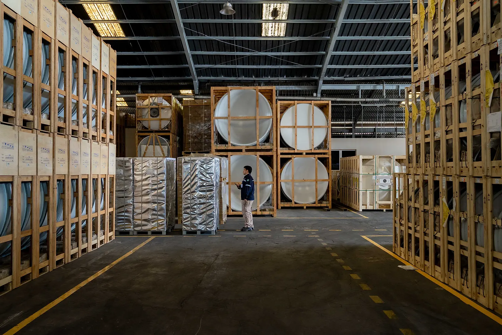 Wooden crates neatly stacked on racking at a DMM warehouse