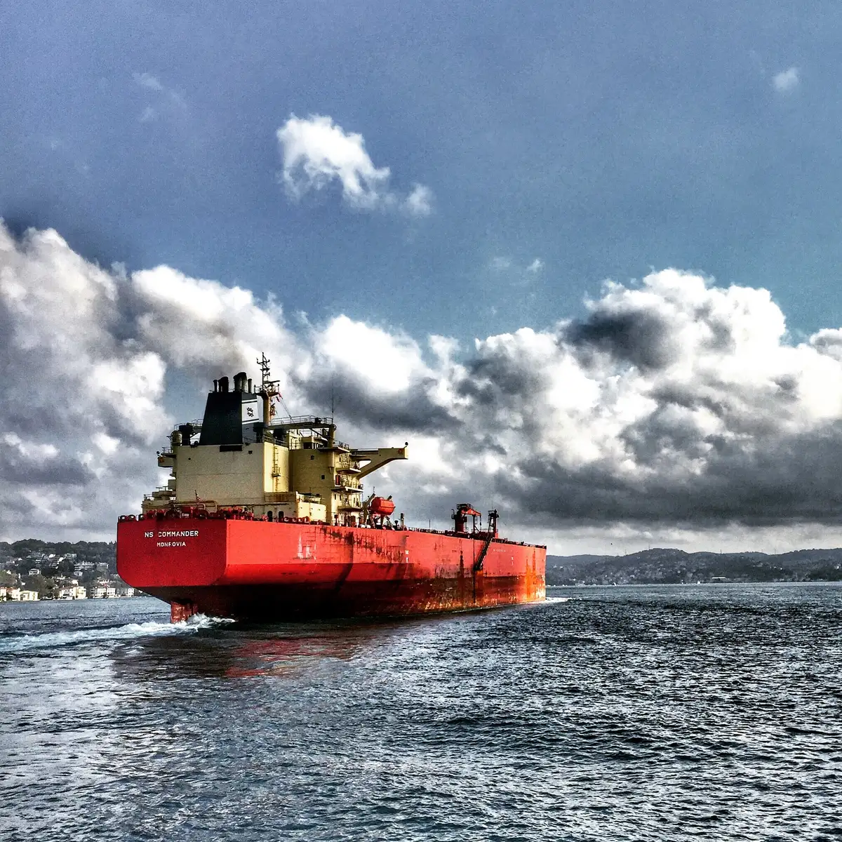 Cargo ship carrying freight towards port